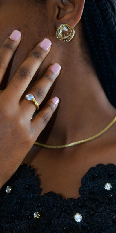 Woman Hand with Ring on Neck